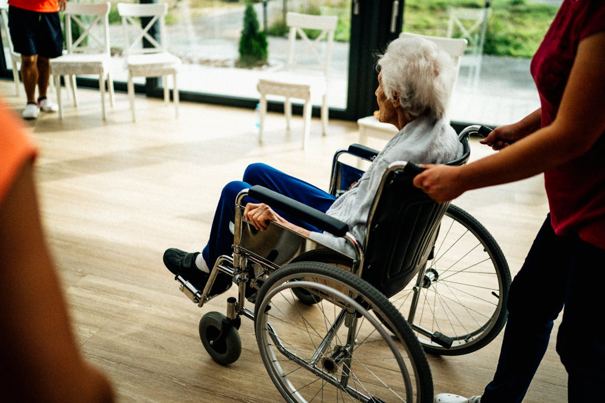 Caregiver providing support to senior